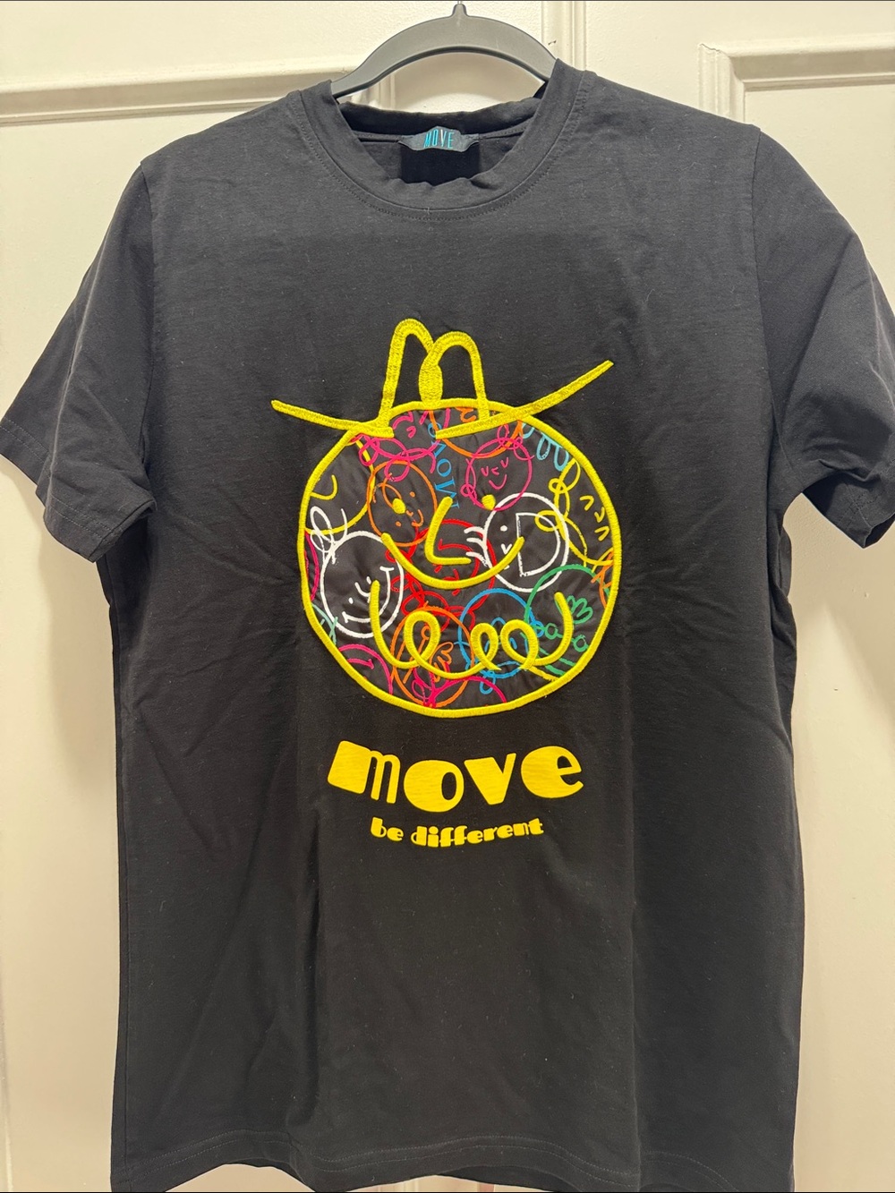 Move Be Different Black Graphic Tee with Neon Multicolor Logo